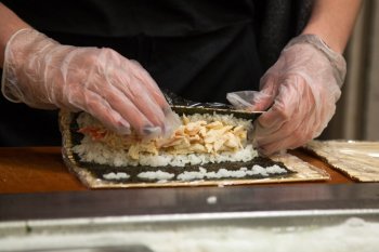a member of staff makes a roll at Dascomb Dining Hall’s sushi bar. Many worldwide students have mentioned Campus Dining providers’ cuisine as culturally ￼appropriative.